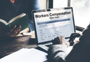 workers' compensation claim on a laptop
