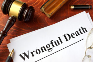 wrongful death document with gavel and pen next to it