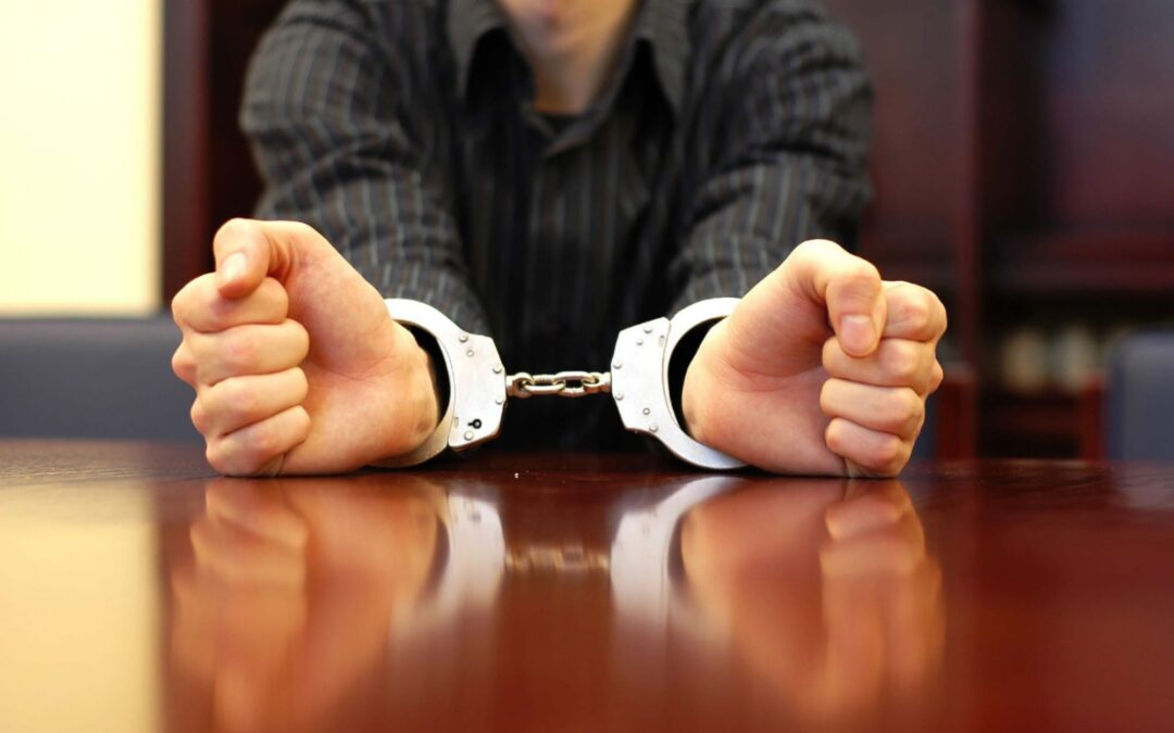 criminal defense lawyer Des Moines, IA - Man hands with handcuffs